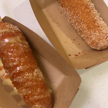Mr.Cow-Ala Moana - Left: cheddar dog topped with sweet chili and cheese mustard. Right: mozzarella stick; no topping - Hot Dogs Near Me - Honolulu, Hawaii