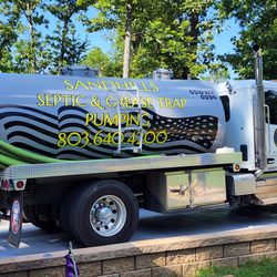 SandHills Land & Septic Services - Company truck doing what they do best. Give them a call if you want the job dine right the first time.