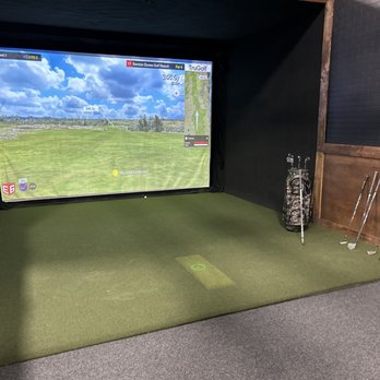 Nine Iron Golf - a golf simulator with a golf ball and tees - Golf Near Me - Yakima, Washington