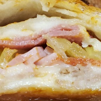 Maola's Pizza and Restaurant - Stromboli. Packed full of meats with a side of tomato sauce. - Italian Near Me - Cornelius, North Carolina Maola's Pizza and Restaurant - Stromboli. Packed full of meats with a side of tomato sauce. - Italian Near Me - Cornelius, North Carolina