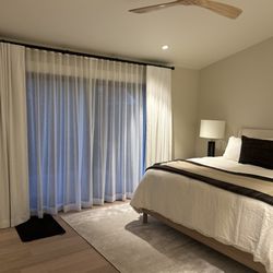 SEI Window Coverings - Blackout and privacy drapery panels on dual rod