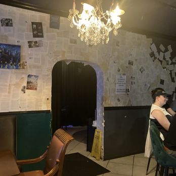 Library Speakeasy - Book pages on walls - Speakeasies Near Me - Lake Worth, Florida
