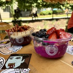 Playa Bowls - Left: Power Acai Bowl with strawberries right: Dragonberry Pitaya Bowl