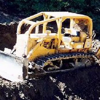 Vic Chiapetta General Engineering - a bulldozer in the mud - General Contractors Near Me