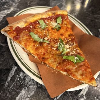 LTD Pizza and Bar - Delicious slice just too spaghetti flavored of a sauce - Pizza Near Me - New York, New York