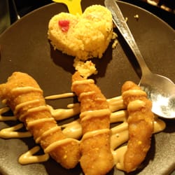 La Solera - Tapa erótica de este restaurante llamado "Con la miel en los labios". Pollo con miel dulce y cuscus con forma de corazón.