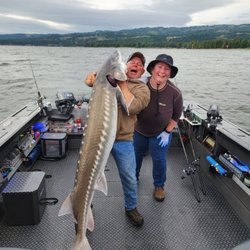 Columbia River Fishing Guides - My big Sturgeon catch! The look on the guides face is the best....