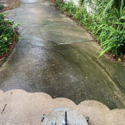 Taylor Boys Power Washing - A dirty driveway never cleaned before.