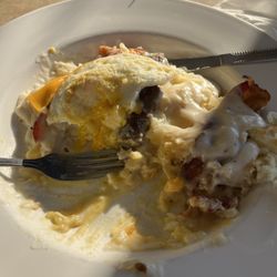 Ela's Eatery - The Haystack skillet with added bacon n sausage.