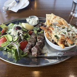 Feta fries, salad, and double beef skewer Feta fries, salad, and double beef skewer