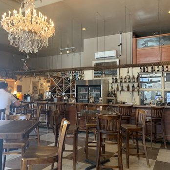 Witch Creek Winery - Sitting area with wine tasting on one side of the cafe. - Wine Bars Near Me - Carlsbad, California