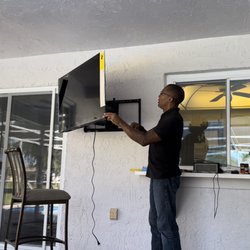 Your Peace Of Mind - Mounting a clients new flatscreen TV on his deck to view from the pool.