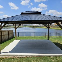 Double R Remodeling - Gazebo with fence-line and lake in background