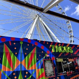 a ferris wheel in the background a ferris wheel in the background