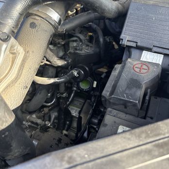 S & K Auto Repair - The green stuff is the coolant that leaked all over the place - that is how we realized the hose had broken off. - Auto Repair Near Me - Fullerton, California S & K Auto Repair - The green stuff is the coolant that leaked all over the place - that is how we realized the hose had broken off. - Auto Repair Near Me - Fullerton, California