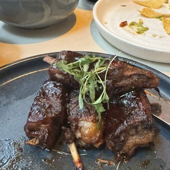 Viva - COSTILLAS, Ancho Rubbed Lamb Ribs. (After I had devoured a few! Fragments of my guacamole  and chips in the background. Not much left! - Mexican Near Me - Las Vegas, Nevada