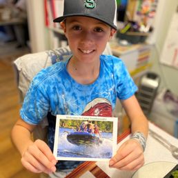 When he registered they sent him an awesome hat and a welcome postcard