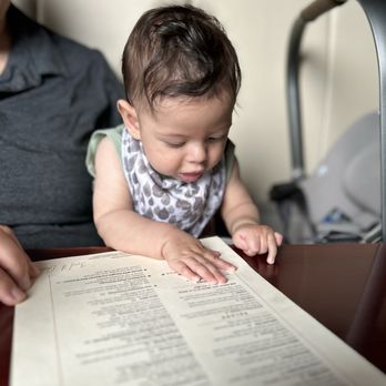 3rd & Cherry - Baby Edison reading the menu - Seafood Near Me - Macon, Georgia
