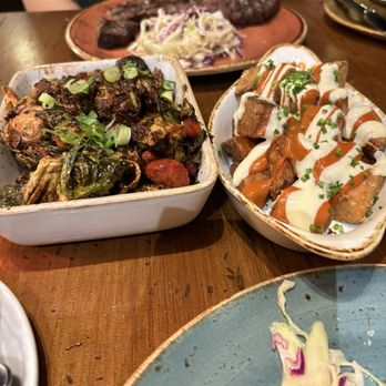 Vaca - Left: Brussel Sprouts w/ sausage; Right: Patatas (Potatoes) - Tapas/Small Plates Near Me - Costa Mesa, California
