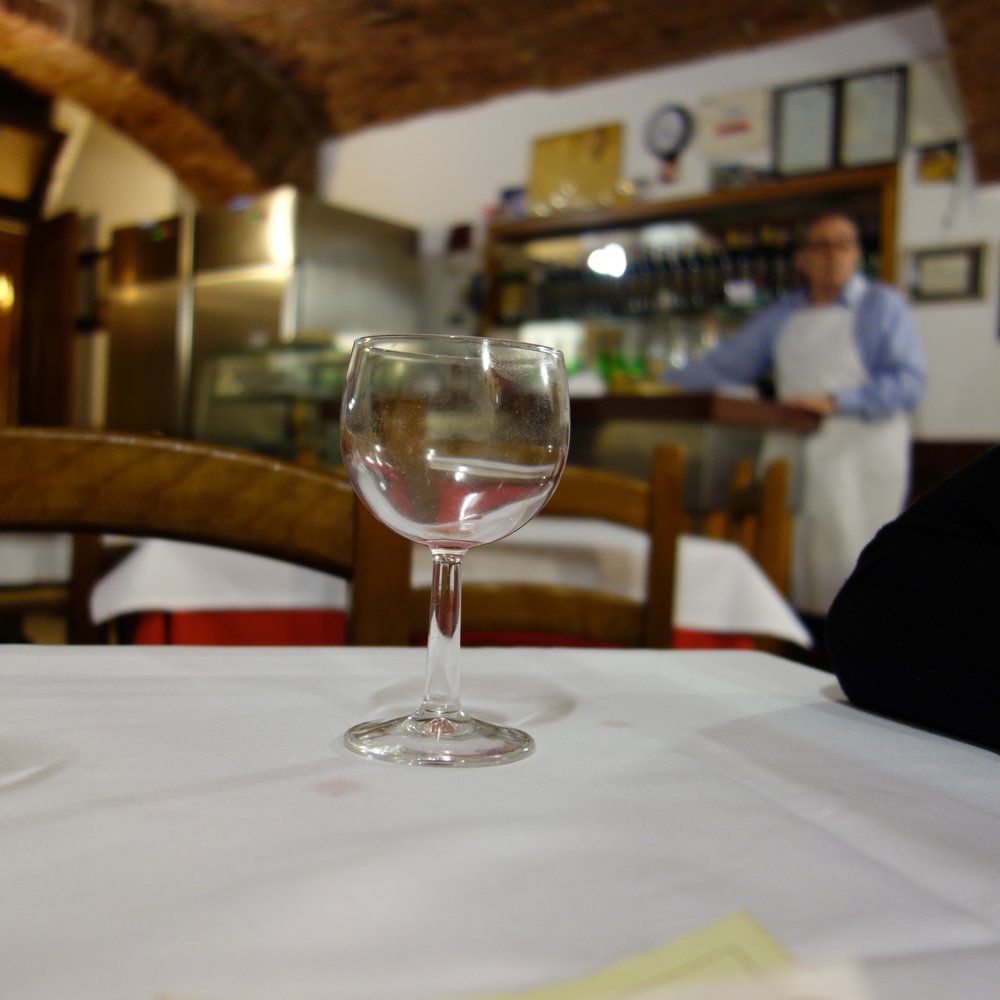 Trattoria La Torre - The owner of La Torre in the background. We tried to get him, but couldn't get a clear pic. - Italian Near Me - Siena, SI
