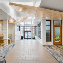 Skin Nirvana - There is a private parking lot behind the building. The spa entrance is located to the left when entering from the parking lot.