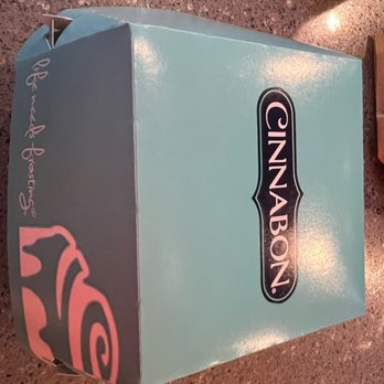 Cinnabon-Carvel - a blue box with a pink logo - Bakeries Near Me - Charlotte, North Carolina