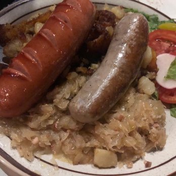 Zum Stammtisch - Bratwurst and knockwurst over home fries. - German Near Me - Glendale, New York
