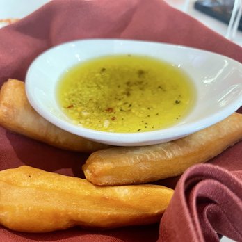 Sapori Cucina & Bar - Fried dough & dipping oil. Their version of bread service. Yummy! - Italian Near Me - Quincy, Massachusetts Sapori Cucina & Bar - Fried dough & dipping oil. Their version of bread service. Yummy! - Italian Near Me - Quincy, Massachusetts