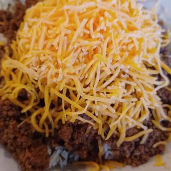 Hard Times Cafe - There is plenty of cheese over this chili and cilantro rice. Yum! - American Near Me - Springfield, Virginia