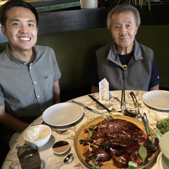 Mister Jiu's - Birthday honoree son and father with the star Peking duck dish - Chinese Near Me - San Francisco, California Mister Jiu's - Birthday honoree son and father with the star Peking duck dish - Chinese Near Me - San Francisco, California