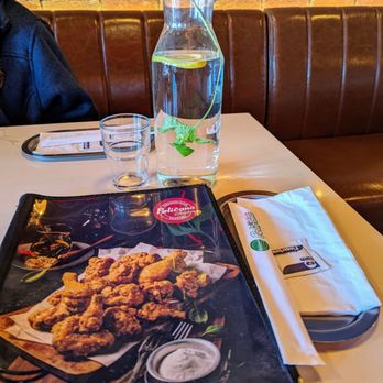 Pelicana Chicken - Bayside - The menu, lemon and mint water for the table and the setting - Chicken Wings Near Me - Bayside, New York Pelicana Chicken - Bayside - The menu, lemon and mint water for the table and the setting - Chicken Wings Near Me - Bayside, New York