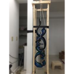 M Alam Restoration - Glass sculpture in process of being restored and reformed.