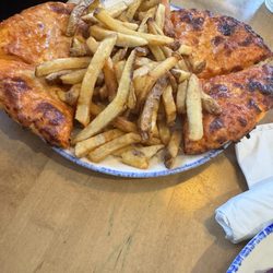 Swiss Chalet Rotisserie & Grill - This is the first pizza delivered to the table.