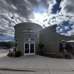 First Watch - Front entrance, outside sign, and outdoor seating area