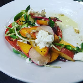 Sylvain - Peach and heirloom tomato salad with chevre, pea sprouts, sunflower seeds and an avocado vinaigrette - Southern Near Me - New Orleans, Louisiana