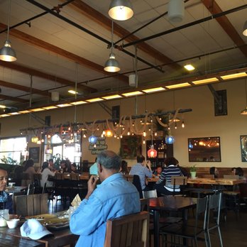 Urban Plates - I love the lighting in here - large table to seat a big party or multiple small parties. - New American Near Me - Dublin, California