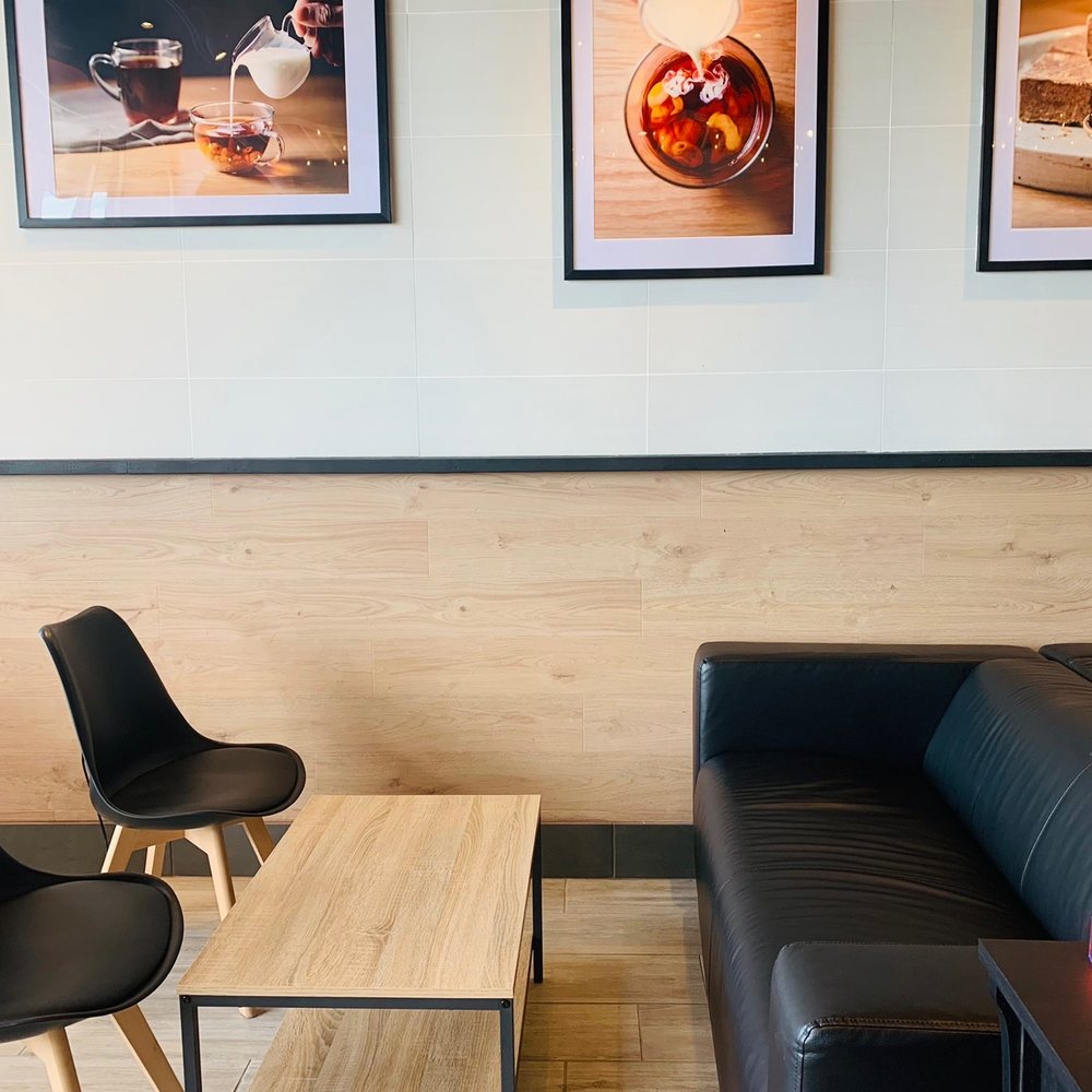 Gong Cha Springfield - a living room with black leather furniture - Bubble Tea Near Me - Springfield, Virginia Gong Cha Springfield - a living room with black leather furniture - Bubble Tea Near Me - Springfield, Virginia