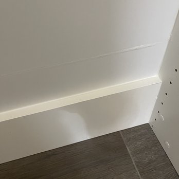 Cabinets Plus - They moved the base down leaving a line on the back wall and stickers on the side walls covering up their mistakes. - Cabinetry Near Me - Irvine, California Cabinets Plus - They moved the base down leaving a line on the back wall and stickers on the side walls covering up their mistakes. - Cabinetry Near Me - Irvine, California