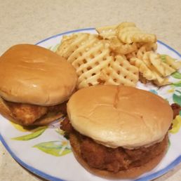 Chicken sandwich and waffle fries with sweet tea