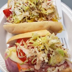 Vince'S Sandwich Shop - The Italian Combo.I get it with oil and vinegar, sprinkled parmesan cheese, lettuce, tomatoes, onions, hot peppers and provolone cheese.
