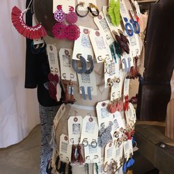Niche - An eclectic array of earrings adorn this mannequin display.