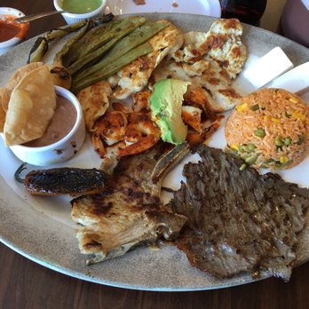 Parrilla La Nueva Fogata - El Fuego Especial. Salt beef, pork chop, spicy shrimp, and grilled chicken. Refried beans and rice. $15. - Mexican Near Me - Berlin, New Jersey