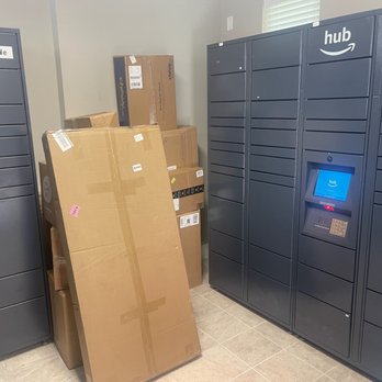 AMLI on Riverside - Tiny Amazon Locker room to share across 7 buildings.  Several boxes didn't make it into a locker because there aren't enough. - Apartments Near Me - Irving, Texas