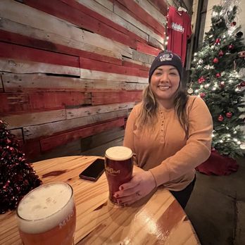 BuckleDown Brewing - My babe enjoying beer in front of their American flag - Breweries Near Me - Lyons, Illinois