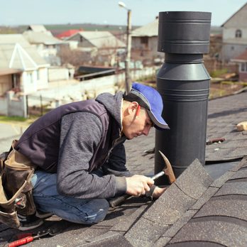 Phoenix Exteriors - Roofer installs shingle on asphalt roof - Solar Installation Near Me - Schaumburg, Illinois Phoenix Exteriors - Roofer installs shingle on asphalt roof - Solar Installation Near Me - Schaumburg, Illinois