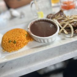 Maria’s Pupusas And Tacos - Yellow rice w/Black Beans & carne asada