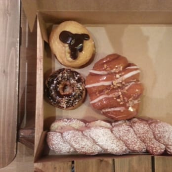 Dutch Monkey Doughnuts - Dutch Monkey, Cinnamon Twist, Nutella, and Not-Samoas. Highly recommend the Dutch Monkey. - Donuts Near Me - Cumming, Georgia