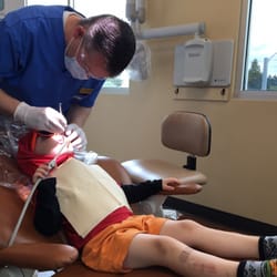 James Alder, DMD - Alder & Mitchell Family Dentistry - Dr. Mitchell inspects our kiddo's teeth. No cavities. #win
