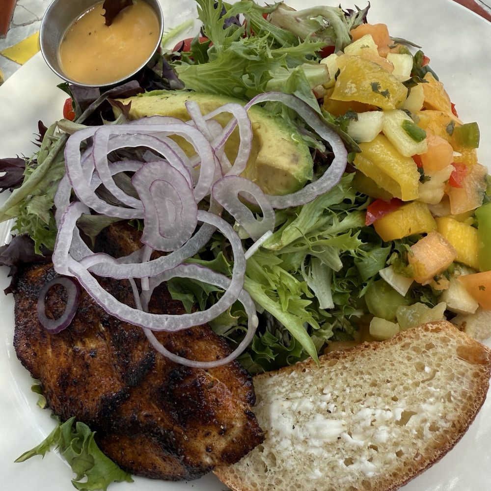 Salute On The Beach - Crab cakes with side of greens. - Italian Near Me - Key West, Florida Salute On The Beach - Crab cakes with side of greens. - Italian Near Me - Key West, Florida