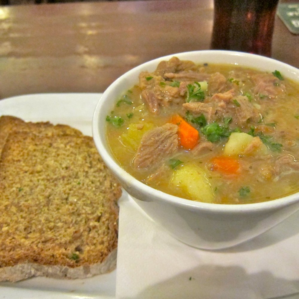 Madigans - Rustic Stew with Slaney Irish Lamb, Seasonal Root Vegetables, Celery, Leeks, Onions and Potato served with Brown Soda Bread. - Pubs Near Me - Dublin, D